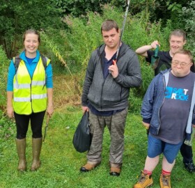 Group photo with Able2Achieve and Lorna at Foxglove Way attenuation basin