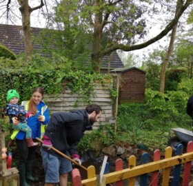Karis with volunteers working in the pond area at The Old School Queen Camel