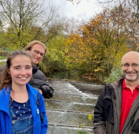 Lorna, Oscar and Lorne stood in front of the Ninesprings weir.